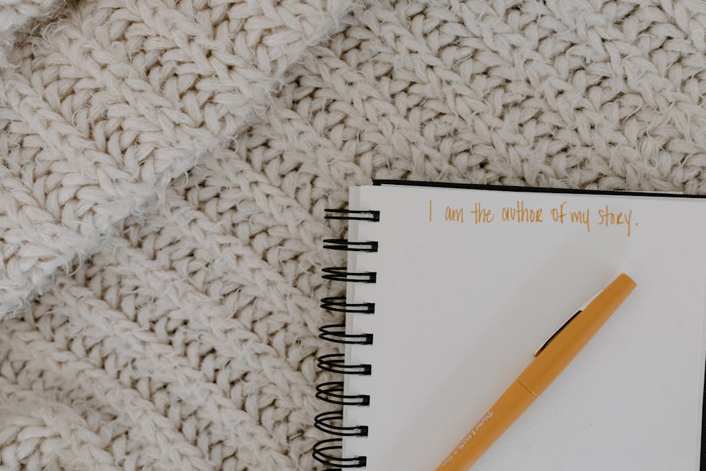 Close-Up Shot of a Pen on a Notebook