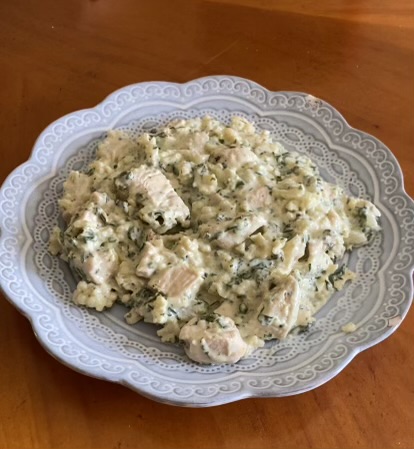 plate of creamy ranch chicken over cauliflower rice