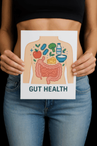 a woman holding a piece of paper about gut health in front of her gut